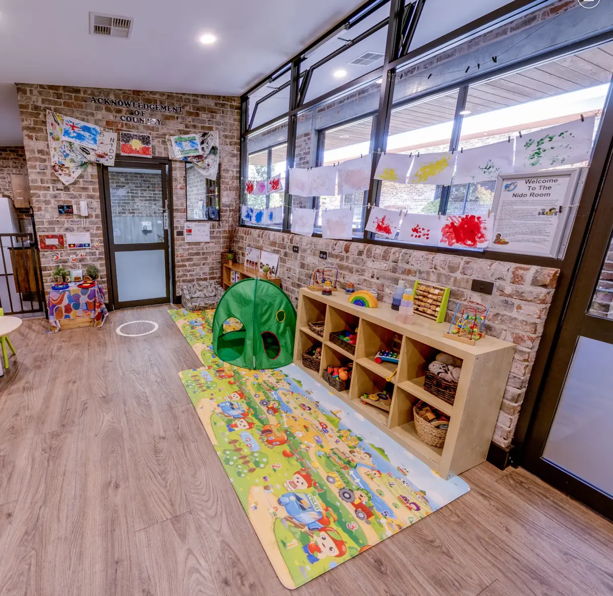 Natural-light Nido room interior with age-appropriate materials at Little Blossoms Academy
