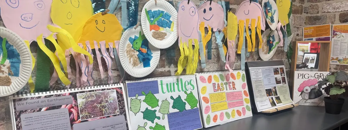 Children's artwork displayed on the wall at Little Blossoms Academy childcare centre