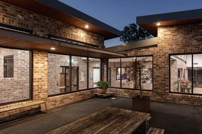 Little Blossoms Academy courtyard lit in the evening at Horsley Park
